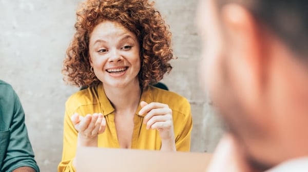 Smiling person with laptop