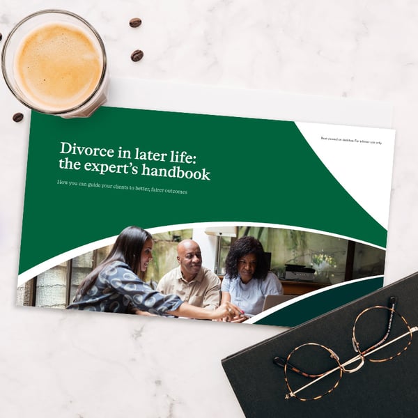 Divorce in later life brochure on a table with a cup of coffee and soe reading glasses