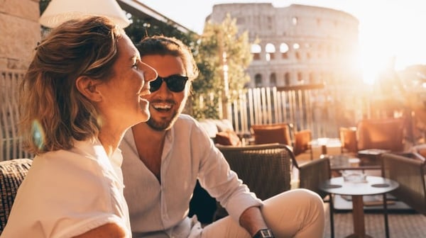 Image showing husband and wife enjoying a drink in the sun