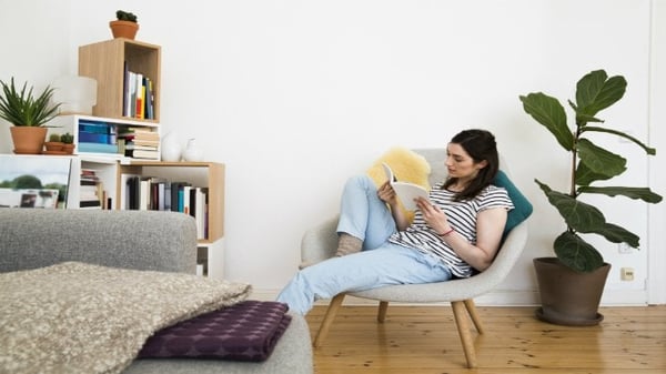 life cover - resources - img - finding lost life insurance - woman reading policy - 730x411