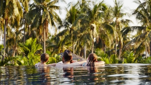 life cover - resources - img - Life insurance and moving abroad - family in swimming pool - 730x411