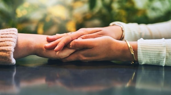 Consoling friends hands