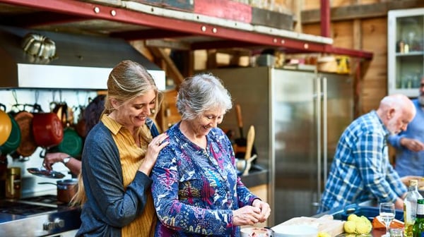 Senior mother and daughter cooking together