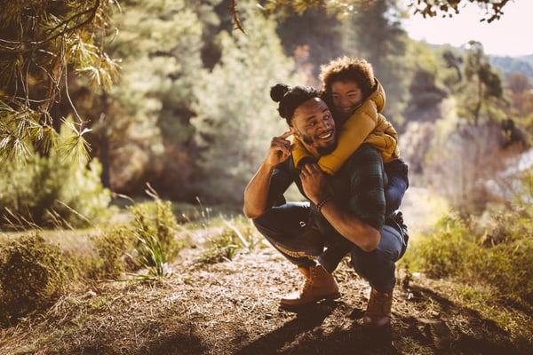 Father and son in forest