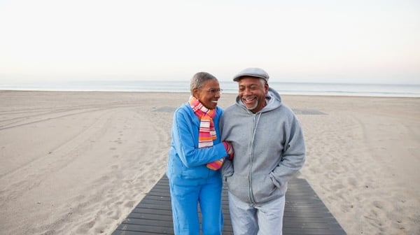 Mature couple hugging on the beach