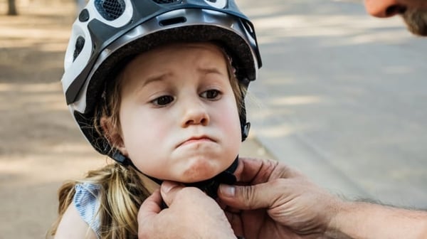Girl with cycling helmet