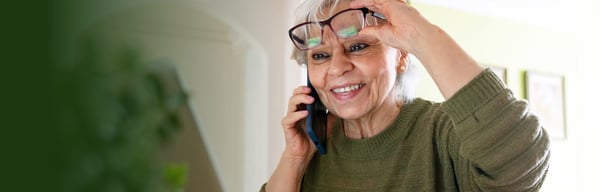 Smiling woman on mobile phone