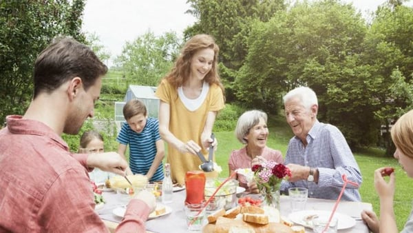 Senior parents and family in the garden toegther