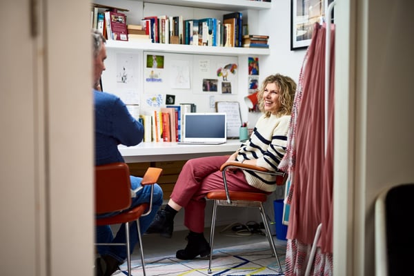 Woman laughing with man