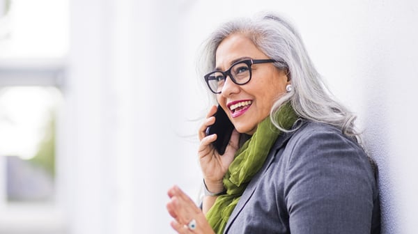 Smiling older woman talking on a mobile phone