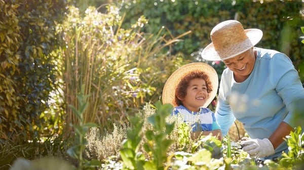 Grandmother with grandson in the garden