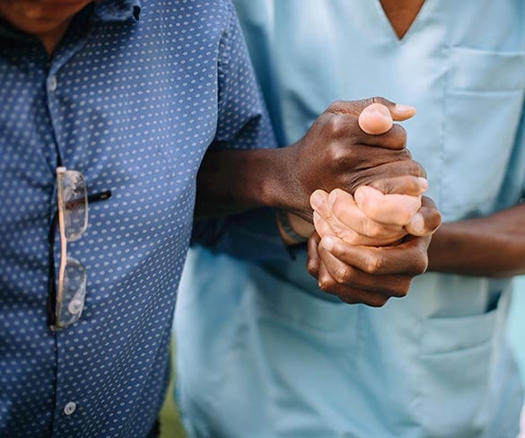 Carer helping older person