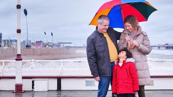 Grandparents and grandson on the pier