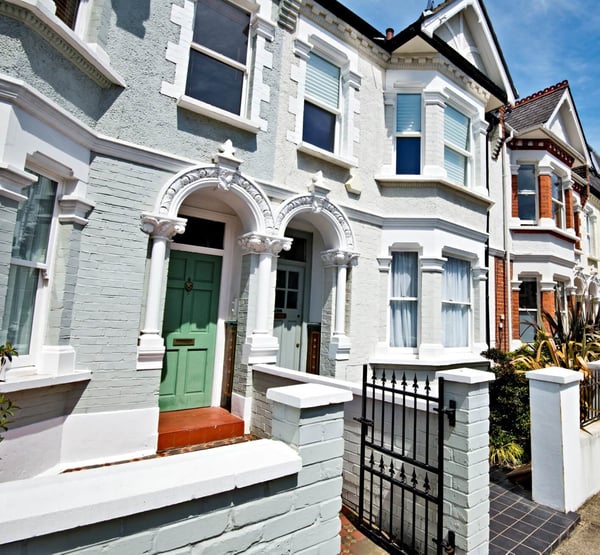A close up image of 2 front doors of semi-detached, Victorian houses