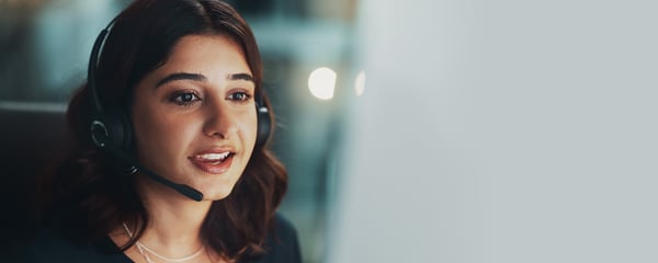 Smiling woman in call centre