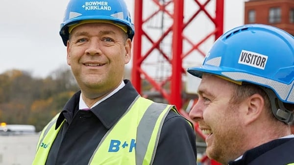 Colleagues talking on a building site