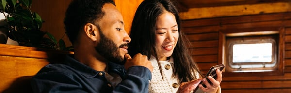 Couple looking at mobile phone