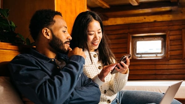 Couple looking at mobile phone