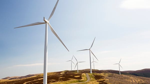 Many wind turbines on a hill