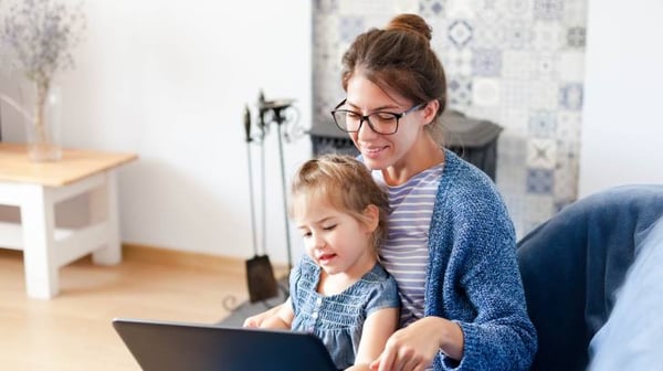 Woman with child at laptop