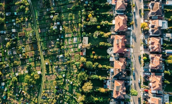 A birds eye view of houses and allotments