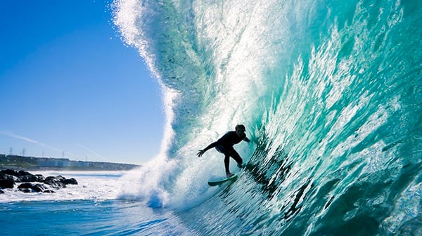 A surfer riding a large wave