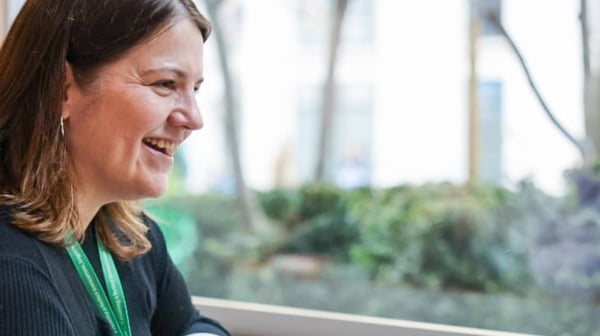 Woman talking with colleague