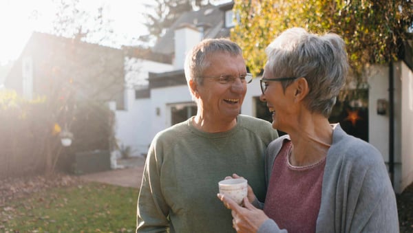 Couple laughing in garden