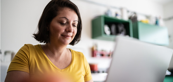 Woman sitting at laptop