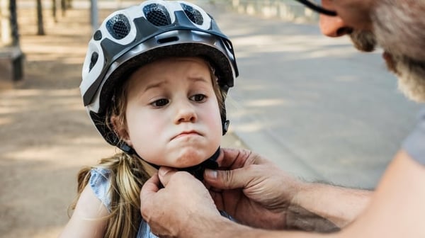 Child wearing bicycle helmet
