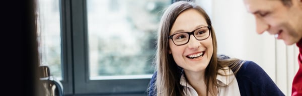 Smiling woman in meeting