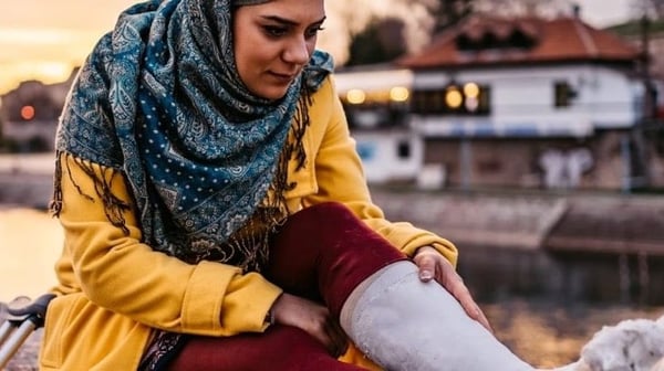 Woman with a plaster cast on her leg