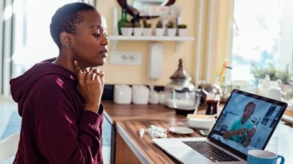 Woman in meeting on laptop