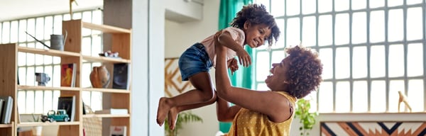 Image of a mum playing with young child