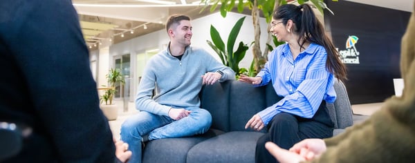Colleagues chatting on sofa
