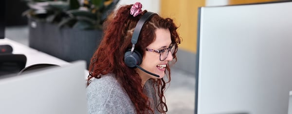 female on phone using headset