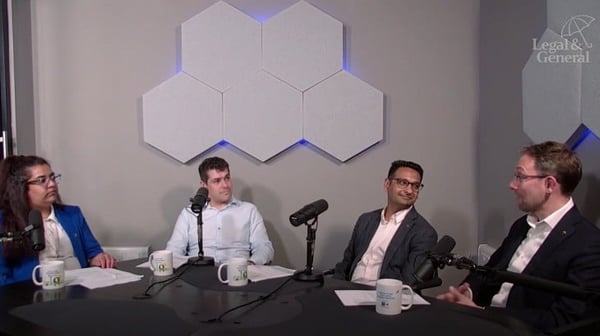 Podcasters sitting around a table