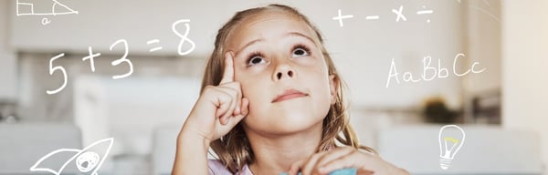 Image of school aged girl solving maths sums