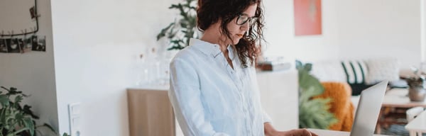 Woman working on laptop at home
