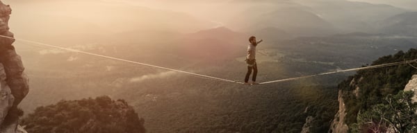 A man walking on a high rope