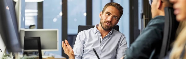 Man chatting with colleague
