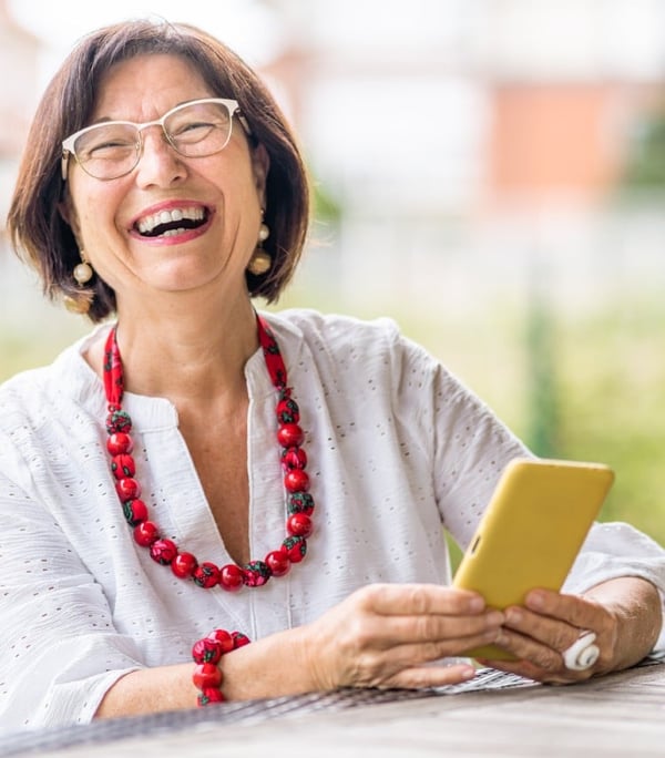 Lady smiling with mobile