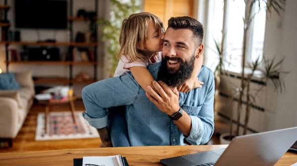 Young father and daughter laughing