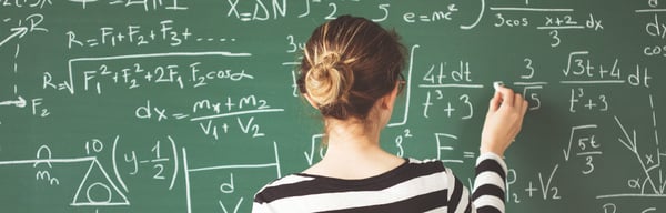 Women doing calculations on a chalk board
