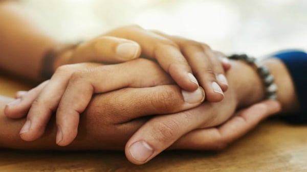 Couple holding hands