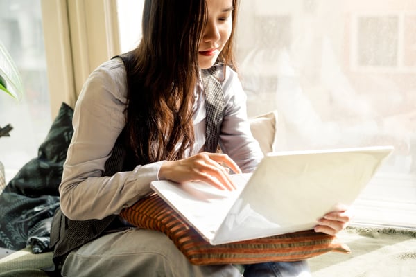 Woman looking at laptop