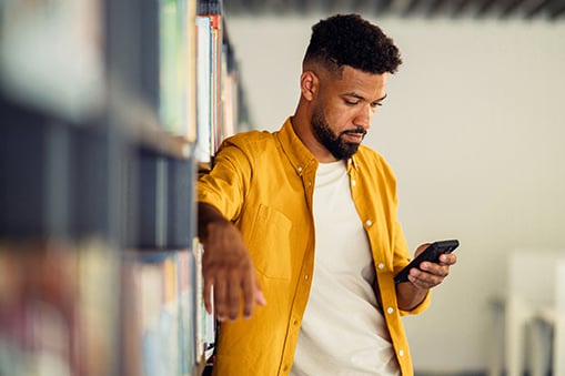 Man looking down at phone