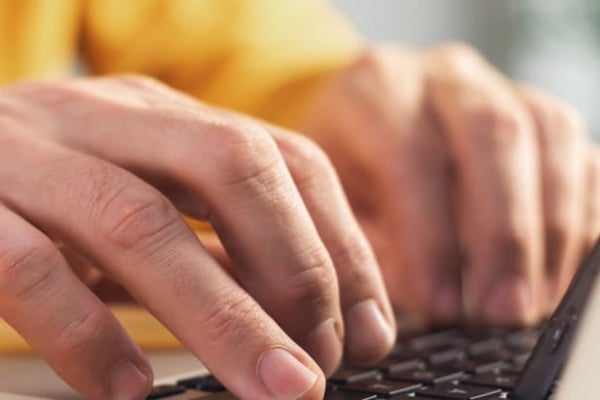 Hands at laptop