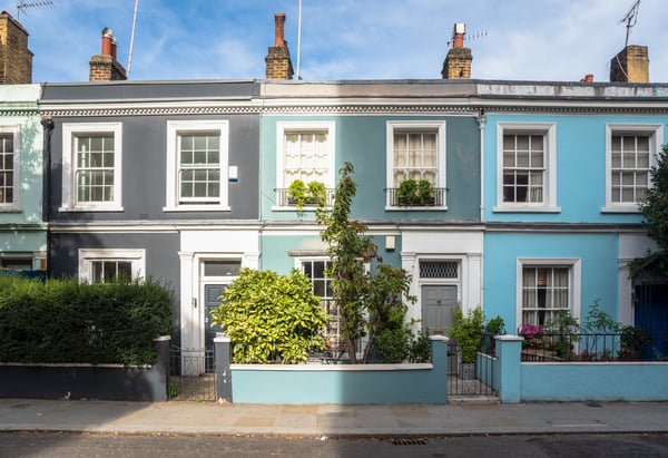 3 terrace houses painted in different shades of green