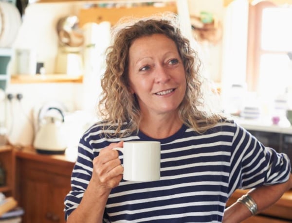 Woman holding mug